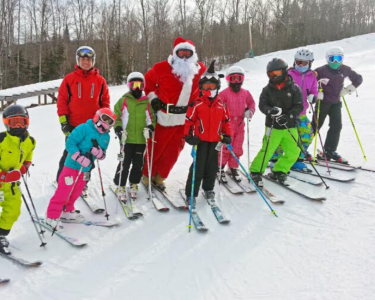Fireworks and skiing Santas
