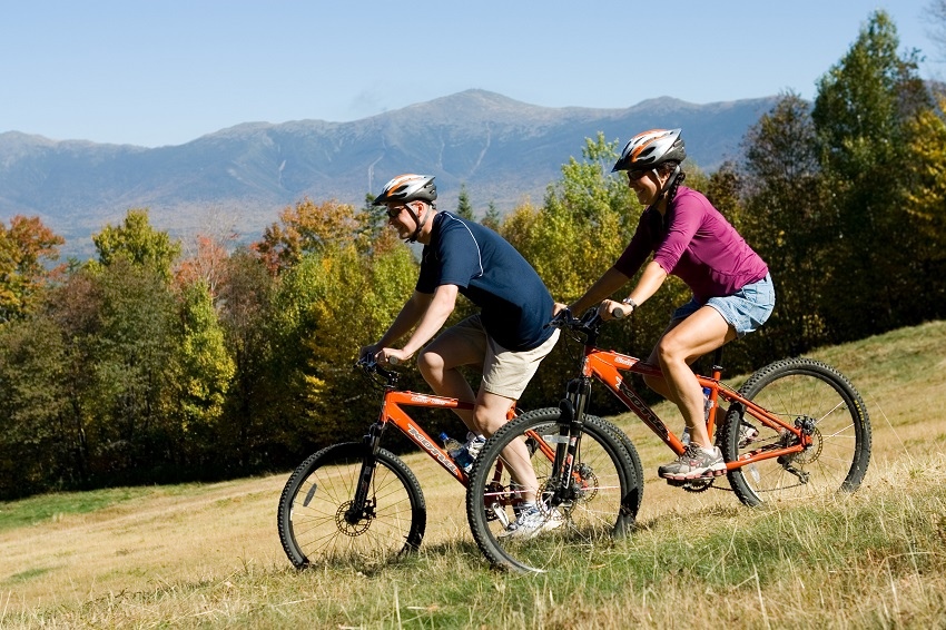 Couple mt biking downhill