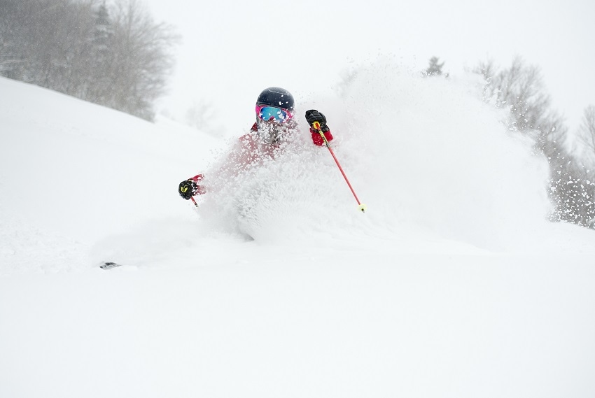 Powder skiing at Cannon red jacket