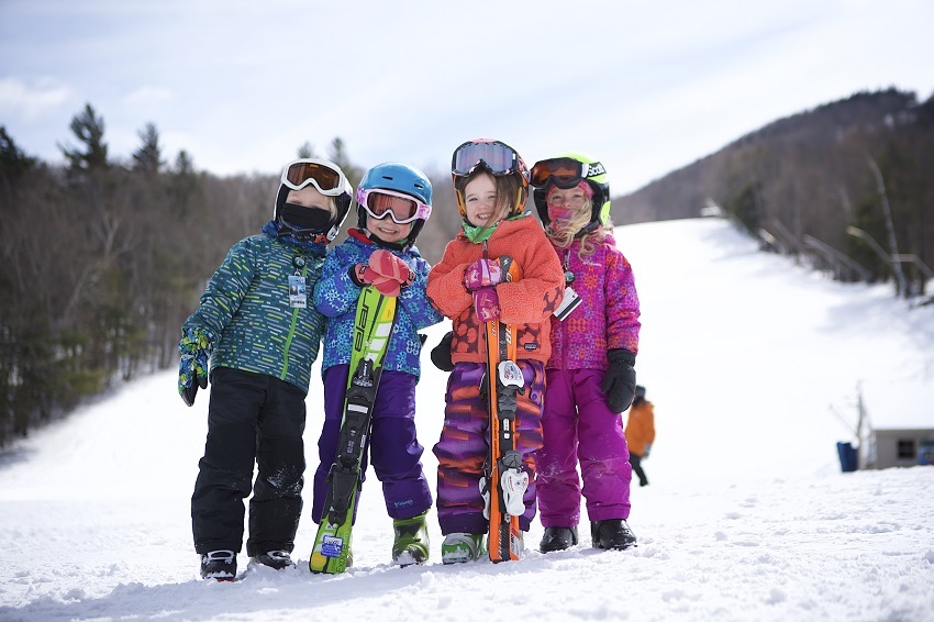 Group of toddlers ready to ski