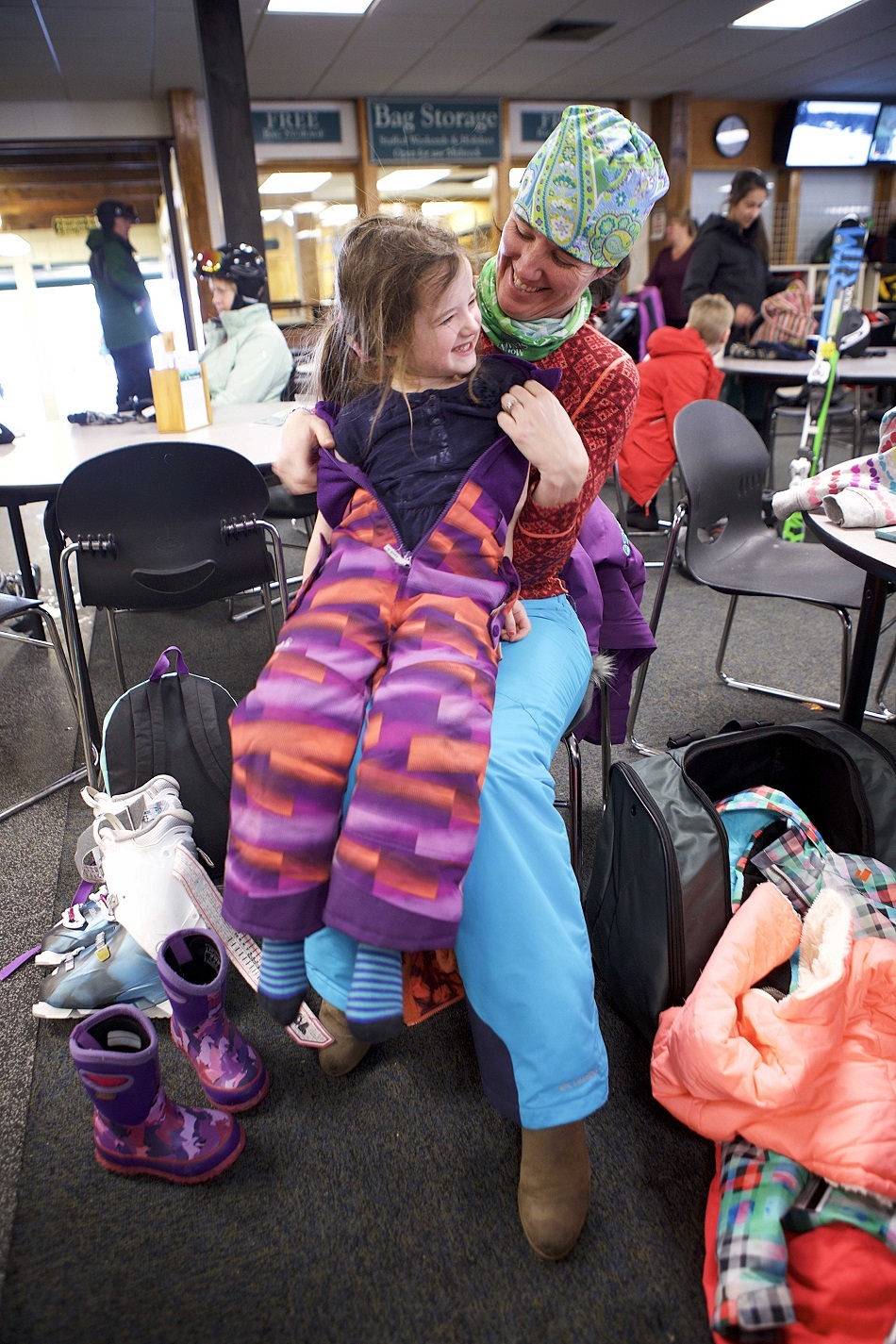 Mom and daughter in ski lodge