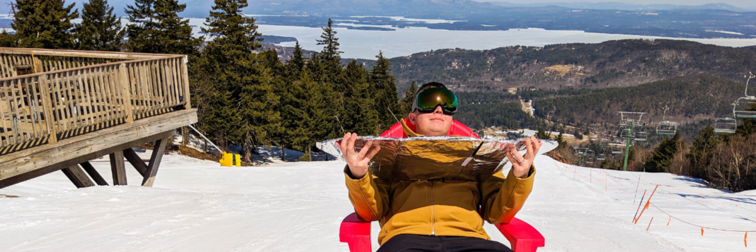 Cool kid in red adirondack chair soaking up the sunshine