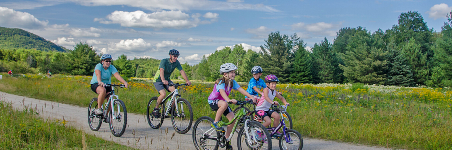 Family biking at Great Glen Trails two adults and three kids