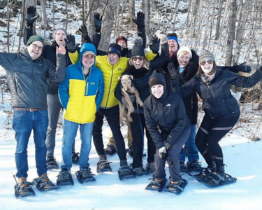 Group of adults snowshoeing