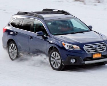 Subaru wagon driving in the snow