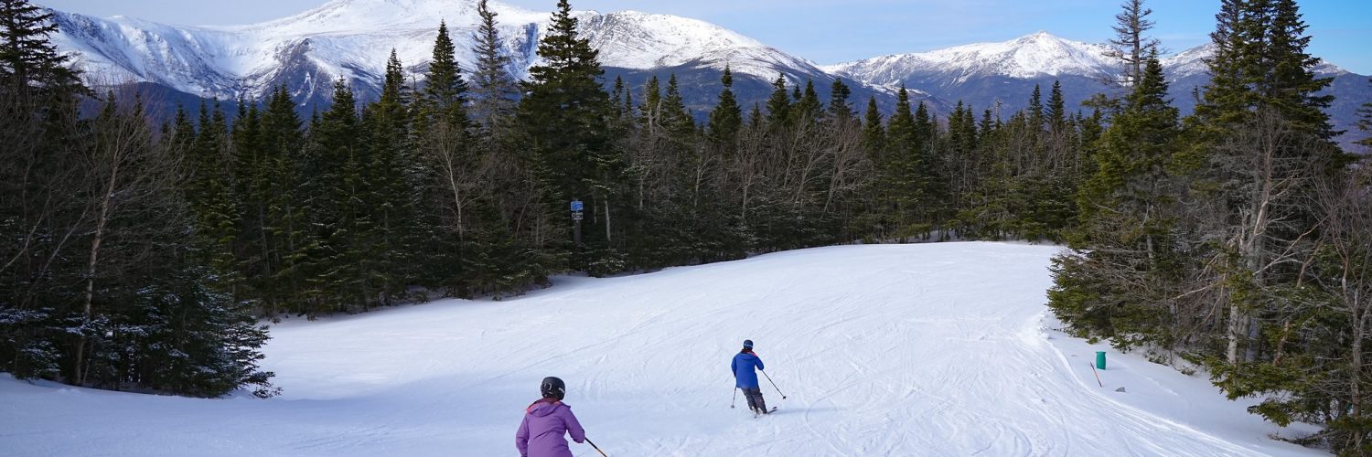Skiers enjoying fresh powder at Wildcat Mountain