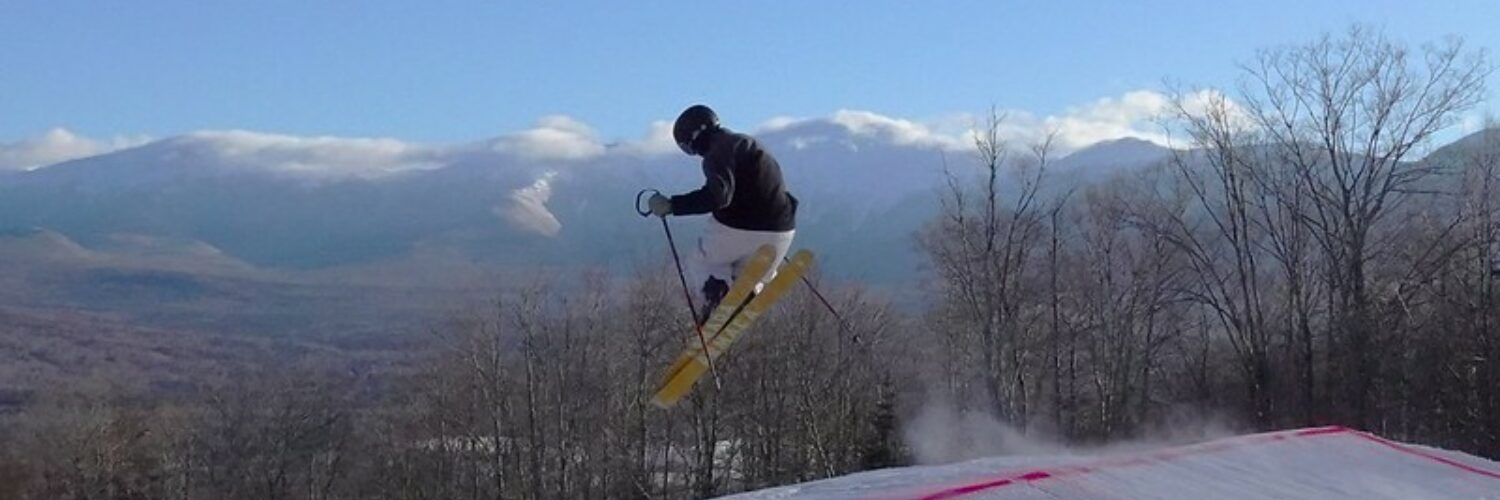 Skier gets air in the Terrain Park in Bretton Woods