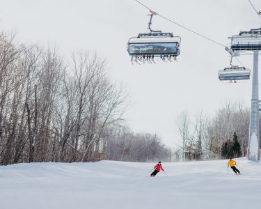 25 Skiers Under The Lift Loon